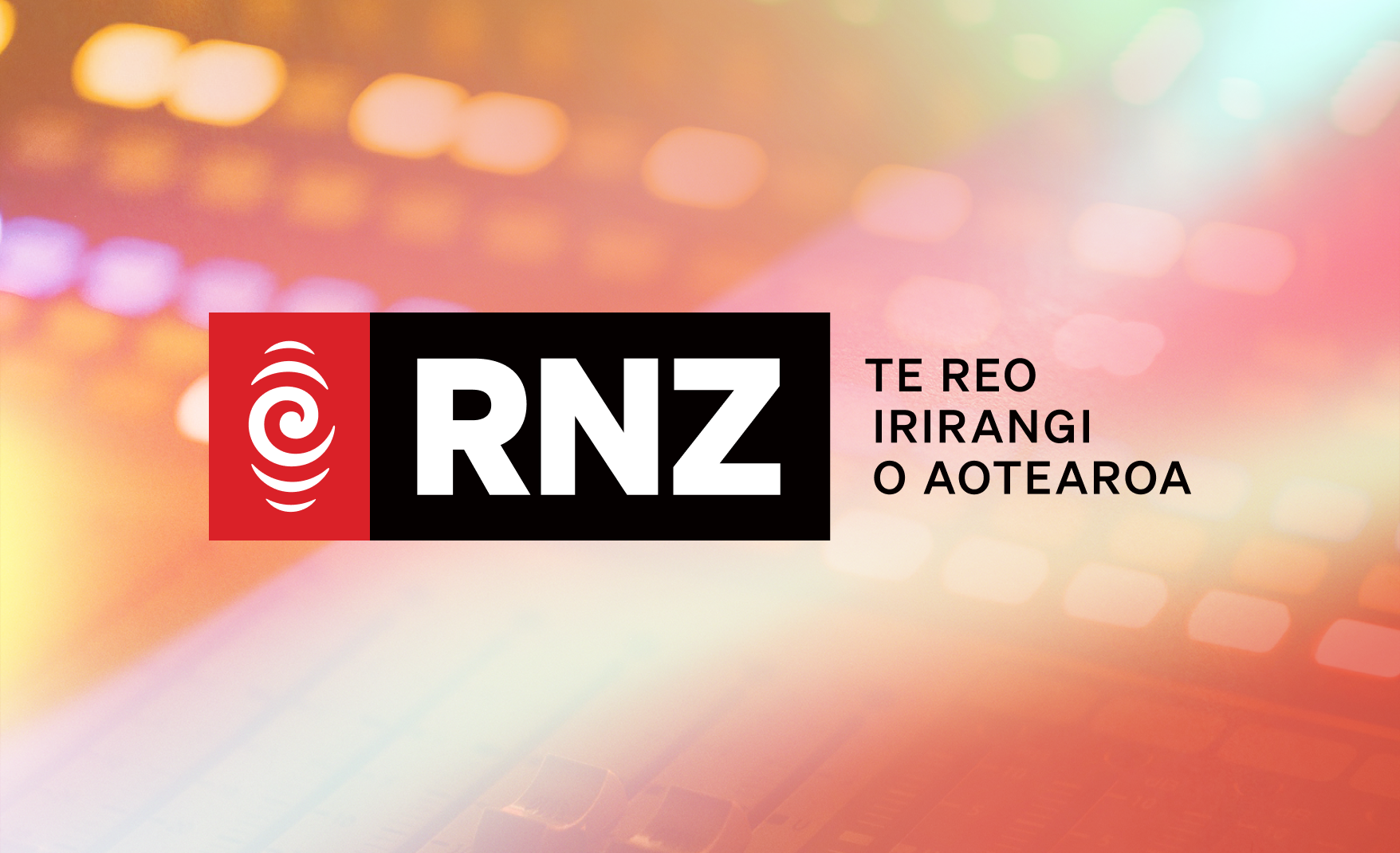 Mixing desk with red hue and RNZ logo